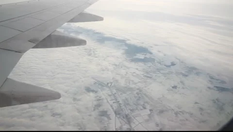 Plane with clouds and snowy ground Stock-Footage 7908160