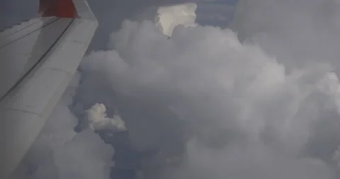 Plane in the clouds tilts, 4K Stock Footage 221265399