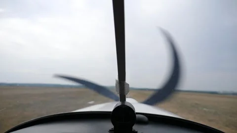 Plane cockpit view showcasing propeller motion as aircraft prepares for takeoff Stock Footage 323467651