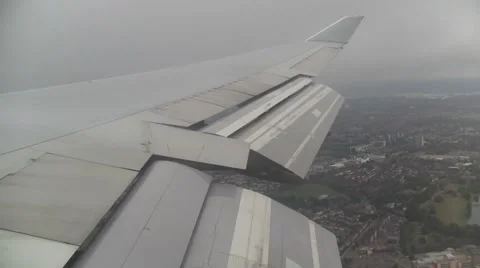 Plane comes out of clouds for landing Stock Footage 2138421