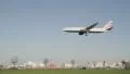 Plane coming in to land over a busy road HD Footage