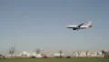Plane coming in to land over a busy road HD Footage