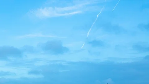 Plane con trails blue sky time lapse clouds Stock Footage 92855659