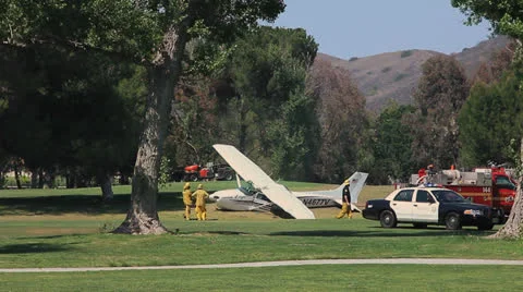 PLANE CRASH ON GOLF COURSE Stock Footage 22952497