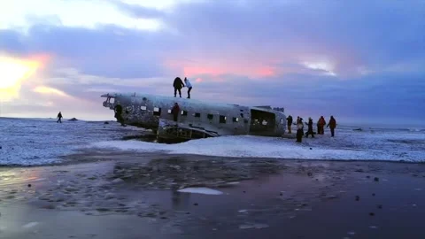 Plane crashed on frozen Solheimasandur beach in winter with snow in Iceland Stock Footage 280642665
