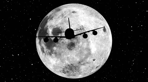 A plane crossing the face of the moon Stock Footage 40724041