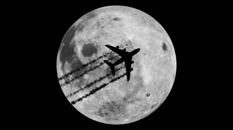 A plane crossing the face of the moon Stock Footage 40724053