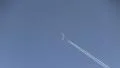 Plane crossing the moon HD Footage