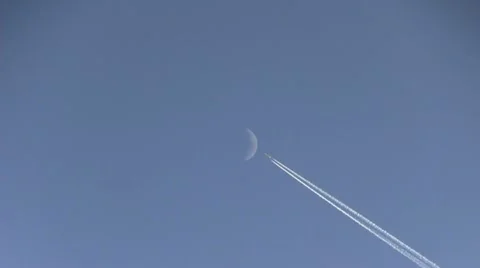 Plane crossing the moon | Stock Video | Pond5