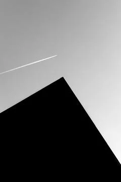 Plane crossing the sky Stock Photos