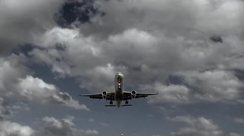 Plane descending over the camera for landing at an airport Stock Footage 59735815