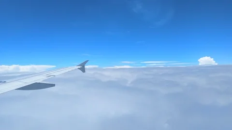 Plane Dipping in the Sea of Clouds Stock Footage 102149147