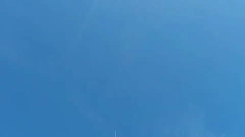 Plane dividing the sky in two Stock Footage 77887183