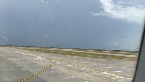 Plane Drive Down the Airport Runway before Take Off in Cambodia Stock Footage 336300324