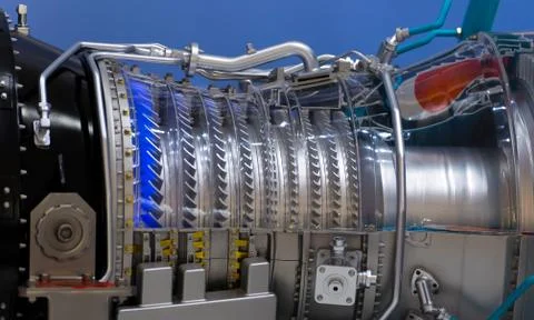 Plane engine element. Turbine blades. Blue light Stock Photos
