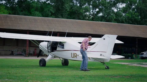 Plane engineer checking airplane on airdrome. Aircraft preflight inspection Stock Footage 203845553