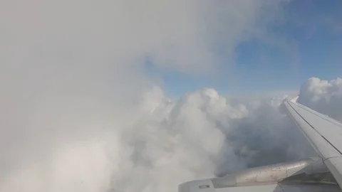 Plane enters a mass of white clouds. View from the airplane window Stock Footage 121826906