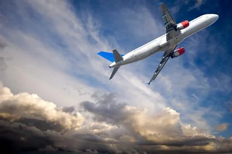 Plane escape from dark thunder clouds Stock Photos