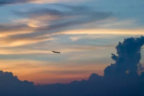 Plane with the evening sky and clouds Stock-Fotos