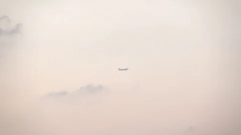 Plane in the evening sky Stock Footage 85327999