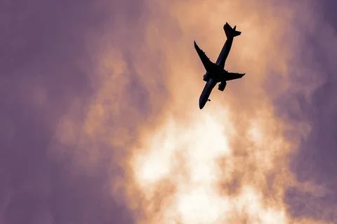 The plane is falling. Plane crash, uncontrolled aircraft in a tailspin Stock Photos