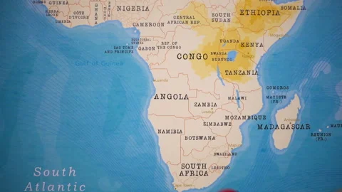 A plane with a flag of Angola crossing the map. Stock Footage 143980692
