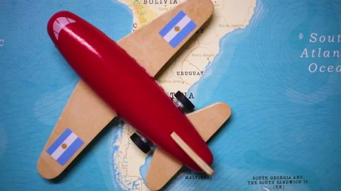A plane with a flag of Argentina crossing the map. Stock Footage 143980661