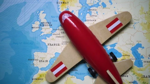 A plane with a flag of Austria crossing the map. Stock Footage 143983368