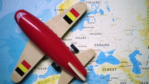 A plane with a flag of Belgium crossing the map. Stock Footage 143983398