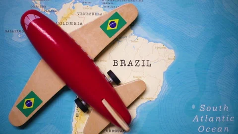 A plane with a flag of Brazil crossing the map. Stock Footage 143984320