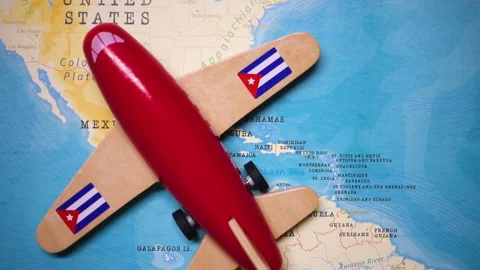 A plane with a flag of Cuba crossing the map. Stock Footage 143981226