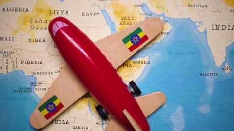 A plane with a flag of Ethiopia crossing the map. Stock Footage 143981492