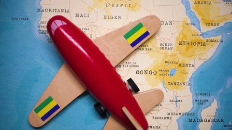 A plane with a flag of Gabon crossing the map. Stock Footage 143981538