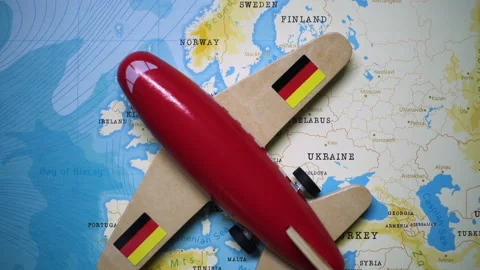 A plane with a flag of Germany crossing the map. Stock Footage 143983488