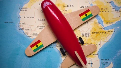 A plane with a flag of Ghana crossing the map. Stock Footage 143981657