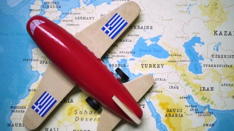 A plane with a flag of Greece crossing the map. Stock Footage 143983527