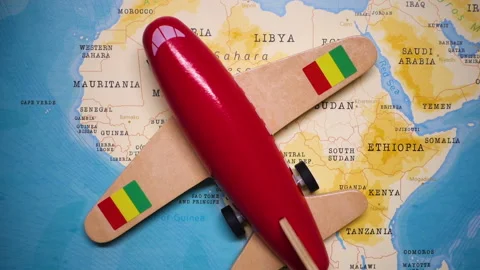 A plane with a flag of Guinea crossing the map. Stock Footage 143981667