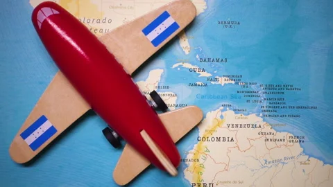 A plane with a flag of Honduras crossing the map. Stock Footage 143981833