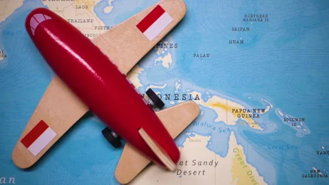 A plane with a flag of Indonesia crossing the map. Stock Footage 143981897