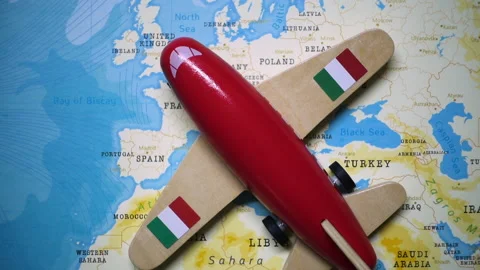 A plane with a flag of Italy crossing the map. Stock Footage 143983533