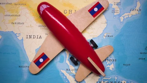 A plane with a flag of Laos crossing the map. Stock Footage 143982160