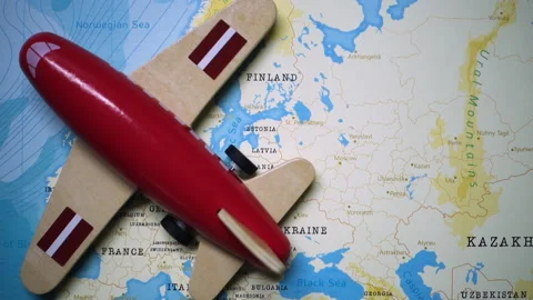 A plane with a flag of Latvia crossing the map. Stock Footage 143983548