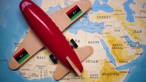 A plane with a flag of Libya crossing the map. Stock Footage 143982147