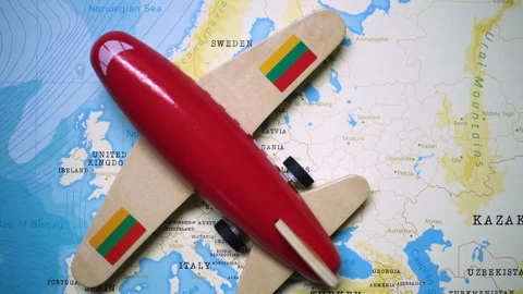 A plane with a flag of Lithuania crossing the map. Stock Footage 143983615