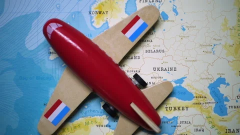 A plane with a flag of Luxembourg crossing the map. Stock Footage 143983617