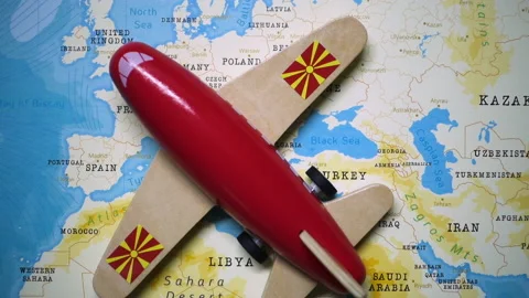 A plane with a flag of Macedonia crossing the map. Stock Footage 143983622