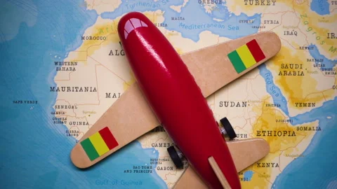 A plane with a flag of Mali crossing the map. Stock Footage 143982176