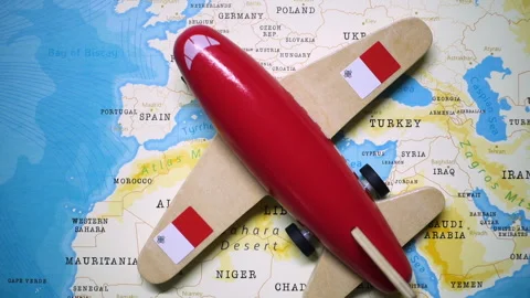 A plane with a flag of Malta crossing the map. Stock Footage 143983629