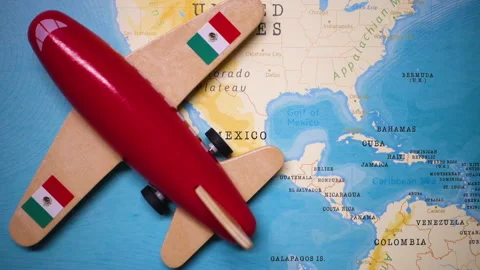 A plane with a flag of Mexico crossing the map. Stock Footage 143982238