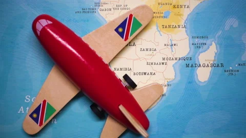 A plane with a flag of Namibia crossing the map. Stock Footage 143982324